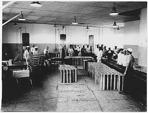 African American men work to build ammunition